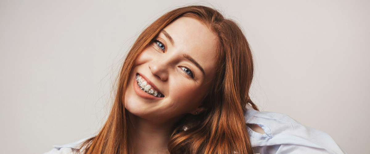 Smiling teenage girl with braces